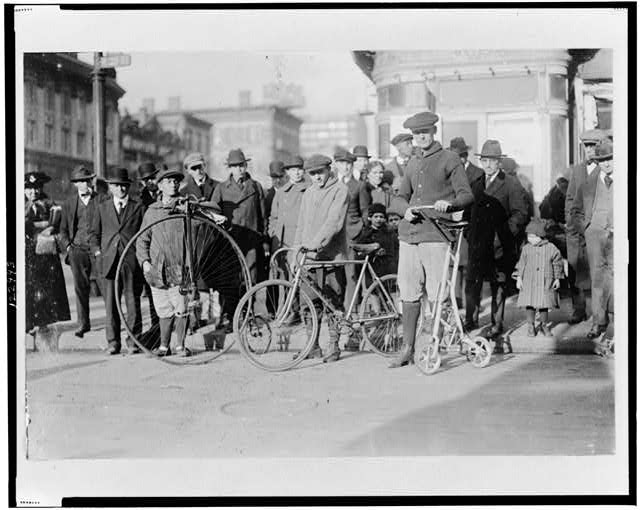 Men with three types of bicycles